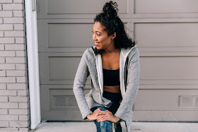 Pancake Stacker in a fitness outfit, wearing Sweaty Betty Zero Gravity Run Leggings, Adidas Ultra Boosts, J.Jill Zip jacket.