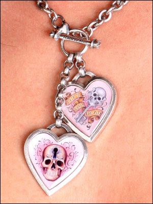 The stainless steel Double Skull Tattoo Heart Charm Necklace features a 