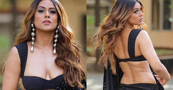 Nia Sharma cleavage black saree hot actress