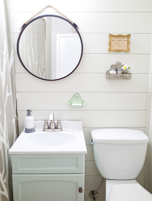 shiplap bathroom wall round mirror