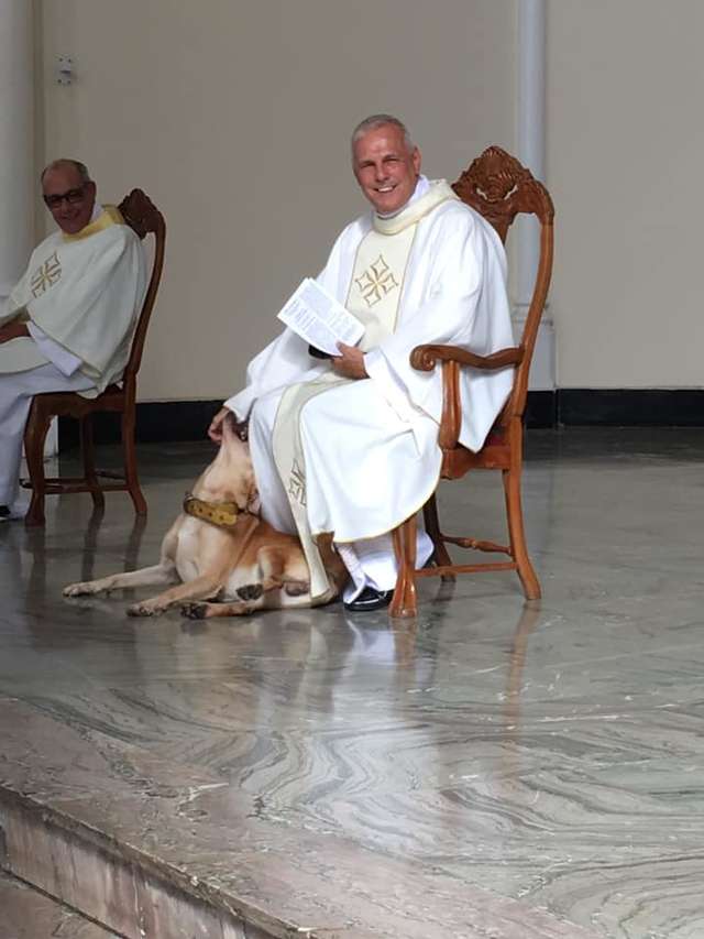 Playful Dog Crashes Church Service And The Priest's Reaction Is Priceless