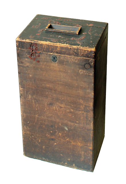 A tall rectangular wooden ballot box with a slot on the top for posting votes. Remains of the liquorice seal on the lid.