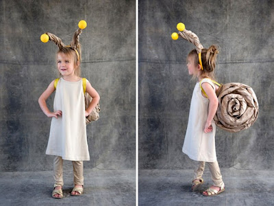 Do you think this Halloween costume is easy to make. You just need brown Kraft paper, cardboard, headband, balls, glue gun... to create this snail costume.