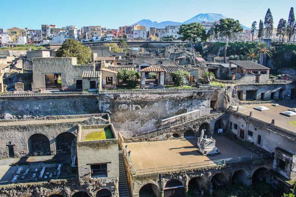The view of the city of Herculaneum with Vesuvius volcano on background