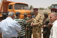 Brig. Gen. Ghassan, commanding officer of the 5th Brigade, 6th Iraqi Army Division, talks with a local television network to get the word out to the local populace about the establishment of the public works substation, June 14, in Yarmouk, a neighborhood in northwest Baghdad.