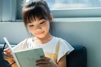 Child reading a book