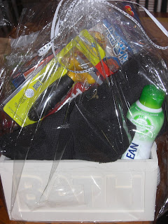 Picture of the gift basket I won from the silent auction.  You can see towels, the Furminator (a really good shedding brush), pedi paws (we will see how Toby likes that!), shampoo, dog treats, tooth brush/paste, and it is all in a really cool box that says BATH