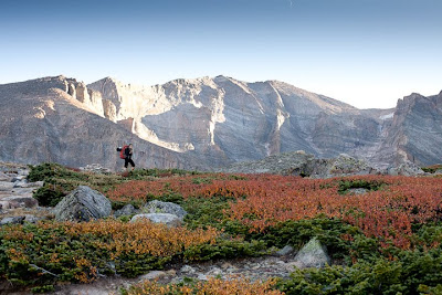 a woman hiking towards longs peak in colorado