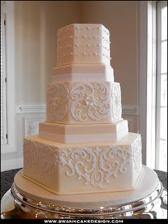 tiered ivory hexagon wedding cake