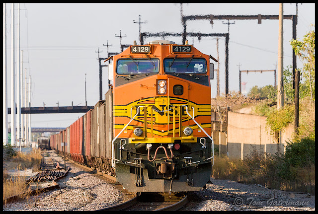 BNSF 4129 is working as the DPU on a train at Branch Street in St. Louis, MO.