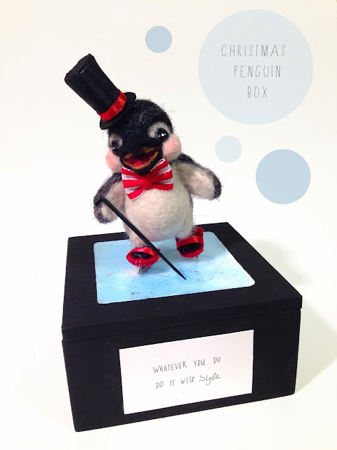 needle felted penguin on rink