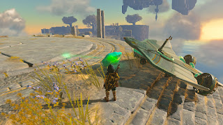 green crystal next to a glider with fans attached
