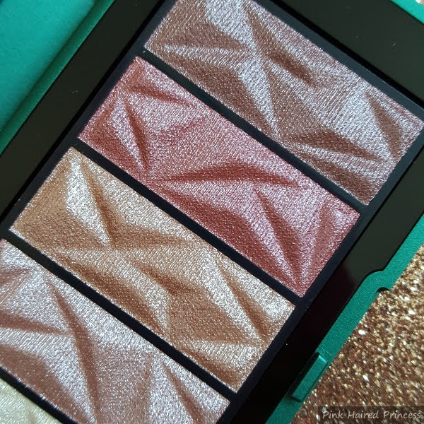 close up of darker neutral eyeshadow palette with gem like surface