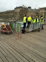 french workers repair lock damaged bridge 1