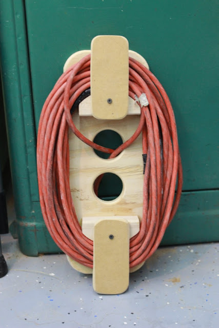 hinged cord holder