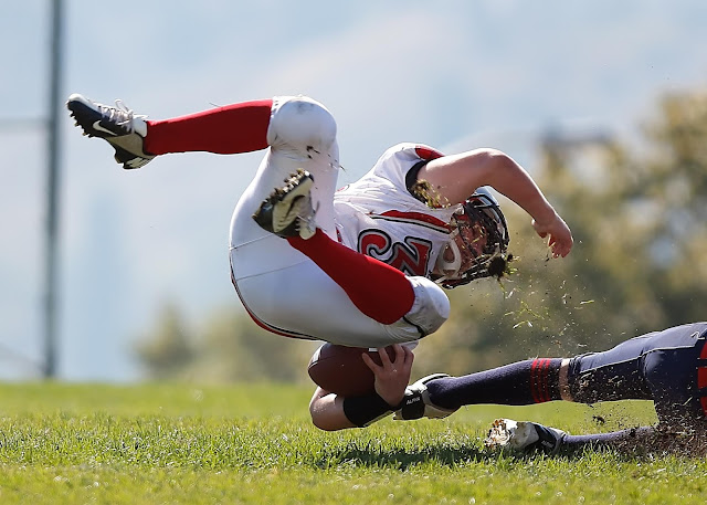 football collision conservation of momentum example