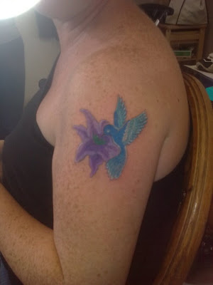 design for a tattoo, you might want to consider hummingbird tattoos.