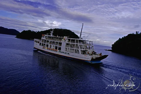 Ferry leaving the Balanacan Port with beautiful islets at the background