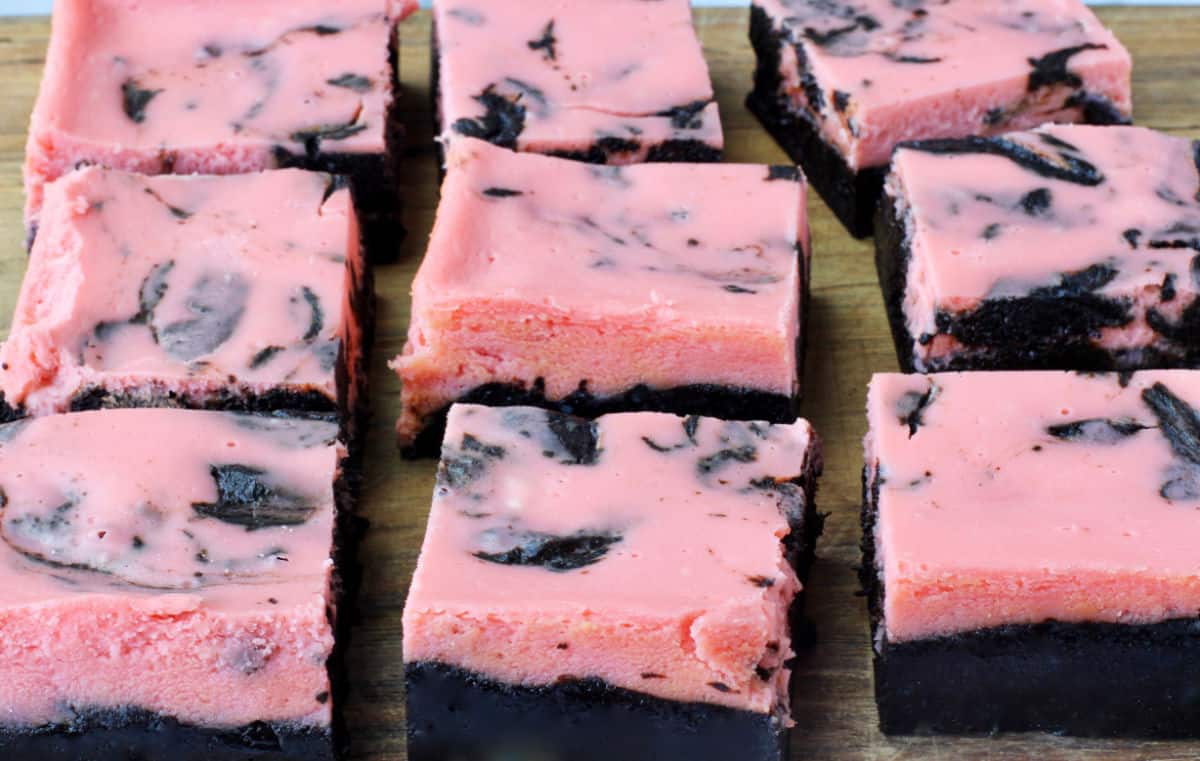 Peppermint Cheesecake Swirl Brownies on a cutting board.