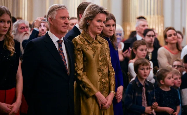 Queen Mathilde wore a floral coat by Dries Van Noten. Princess Elisabeth wore Chrissy dress by Reiss