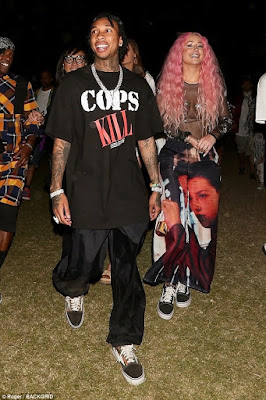 Rapper, Tyga, and Iggy Azalea spotted together at Coachella at Indio, California enjoying each other's company... The "COPS KILL" though! #reminder #staywoke 