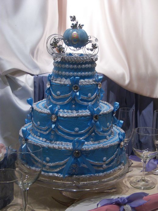  Disney wedding cake with elaborate blue and silvery pearl decorations 