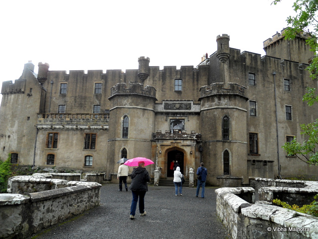 A visit to the Dunvegan Castle and Grounds, Scotland. A bonus view from the castle's grounds...to keep you motivated to visit Scotland. :). Dunvegan Castle is the situated at a distance of about a mile and a half to the North of Dunvegan on the Isle of Skye and it is the seat of MacLeod of MacLeod, the Chief of MacLeod clan. I got a chance to visit it during my visit to the Isle of Skye in 2011. The castle is the oldest continuously inhabited castle in Scotland. In this picture, the people who are visible were a part of our group. It was raining consistently, but that anyways is a constant feature of Scotland's weather. I took a peek into the castle grounds. But I was glad to be able to spend much more time here, as the pictures later will reveal. Stone walls of the castle were good enough ground for a flowering bush to grow. These insurgences of nature are always a welcome sight for a nature-worshipper like me.  The sight from one of the windows of the castle. These castles were built to keep people out. I guess with such views, the people inside would also perhaps prefer to be outside. :) This is Loch Dunvegan, which is famous for its seal tours. Coming back to the castle, here are some pathways through the walls - mystifying and awe-inspiring. And finally the gardens! Numerous little streams were flowing through the dense foliage. Stream flowing parallel to the path - Mesmerising! Some of these waterfalls were artificial while some looked natural. Or perhaps they have been made so long ago that they have started looking like an integral part of the landscape. A little stream flowing out into the Loch Dunvegan. The building on the right is the Castle. A bonus view from the castle's grounds...to keep you motivated to visit Scotland. :)