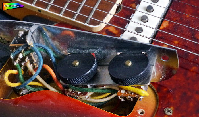 Fender Jaguar under the upper control plate