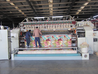 Axminster carpet factory showing weaving on loom