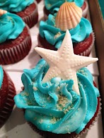 Cupcake Themed Decorations / My sisters cupcakes for her beach themed bridal shower ... - Use a brown table cloth (cupcake batter) topped by a smaller pink or blue table cloth (frosting) and.
