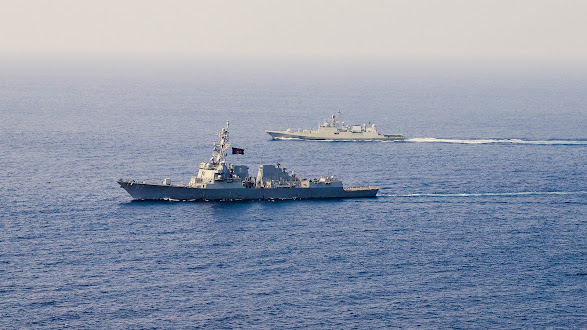 The Arleigh Burke-class guided-missile destroyer USS Momsen (DDG 92) conducts a bilateral training exercise with the Indian Navy's guided-missile frigate INS Trishul (F 43).