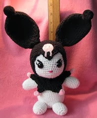 http://www.ravelry.com/patterns/library/large-amigurumi-kuromi-lookalike-doll