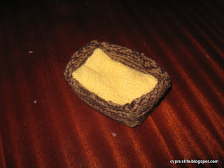 the completed manger and removable 'hay' from the knitted nativity scene