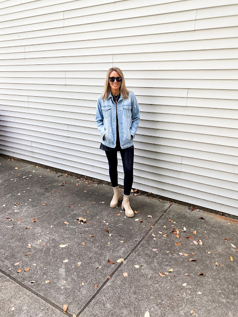 oversized denim jacket with tshirt faux leather leggings and boots