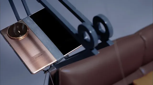 Honor Magic V5 Hinge Strength Test Lifts a Sofa New Fold Phone Tech Snapdragon 8 Elite Chip Release Date