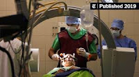 Surgical team prepared a patient for deep brain stimulation by Bernadett Szabo/Reuters