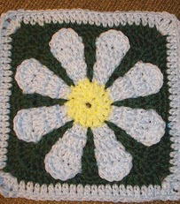 http://www.ravelry.com/patterns/library/daisy-flower-crochet-charity-square