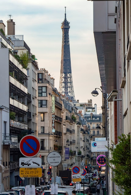 street in Paris with view of Eiffel Tower with lots of no waiting signs