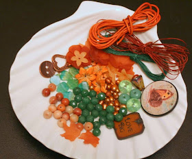 Soup ingredients from Penny Neville of Copper Penny Designs: focal by Marie-Noel Voyer-Cramp of Skye Jewels, polymer clay by Elaine Robataille, a little mushroom by Bubly and McGurk Beads, lampwork by Ericabeads, a lovely copper toggle and button, Czech glass leaves, faceted jade, pearls, lucite :: All Pretty Things