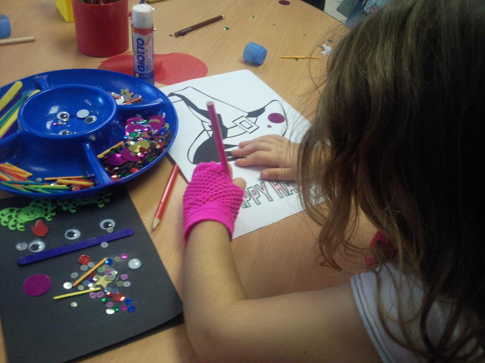 nine and the girls were given black paper to make a Halloween card