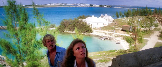 Jacqueline Bisset (as Gail Berke) and Nick Nolte (as David Sanders) at Coney Island, Bermuda in 1976 (Source Sony Pictures).