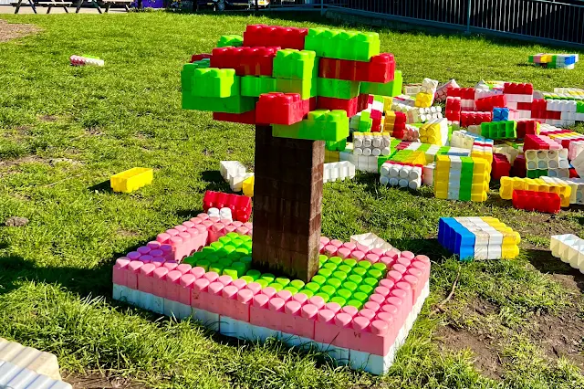 A brick cherry tree made with giant lego type bricks