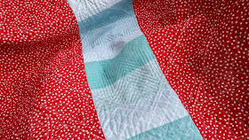 Red and aqua string star round robin quilt