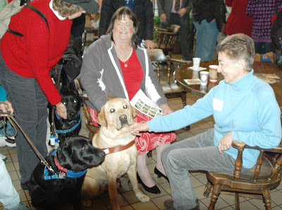 three Labs with their people in GDB CA dorm lunchroom at graduation