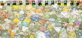 A picture of a lot of dice, including polyhedral dice.