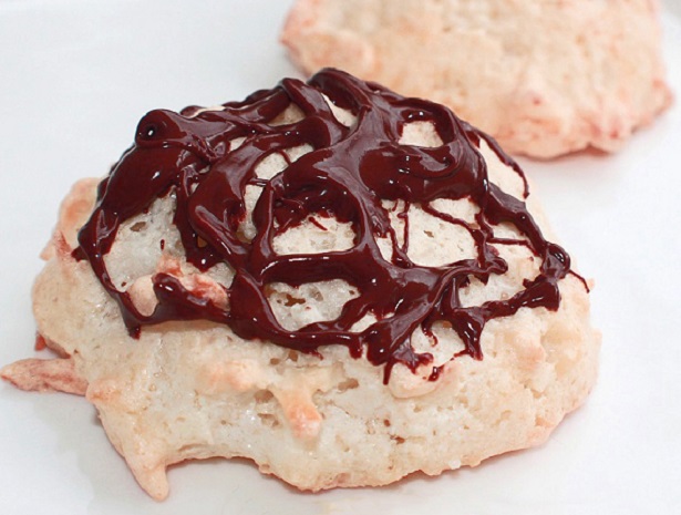 coconut macaroon cookies with chocolate drizzled on top
