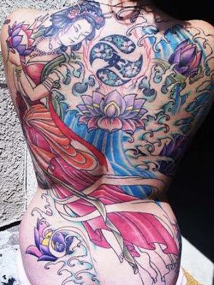 This large Japanese dragon tattoo dominates the entire back of the wearer 