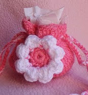 http://www.ravelry.com/patterns/library/small-flower-gift-bag