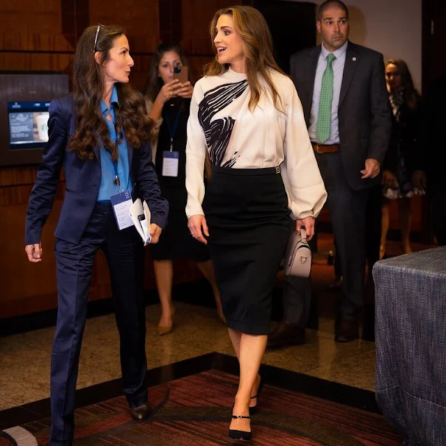 Queen Rania wore a new graphic print blouse by Fendi, and black suede pumps by Jennifer Chamandi