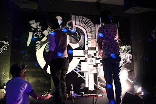 Takeshi painting a Control Freaks mural